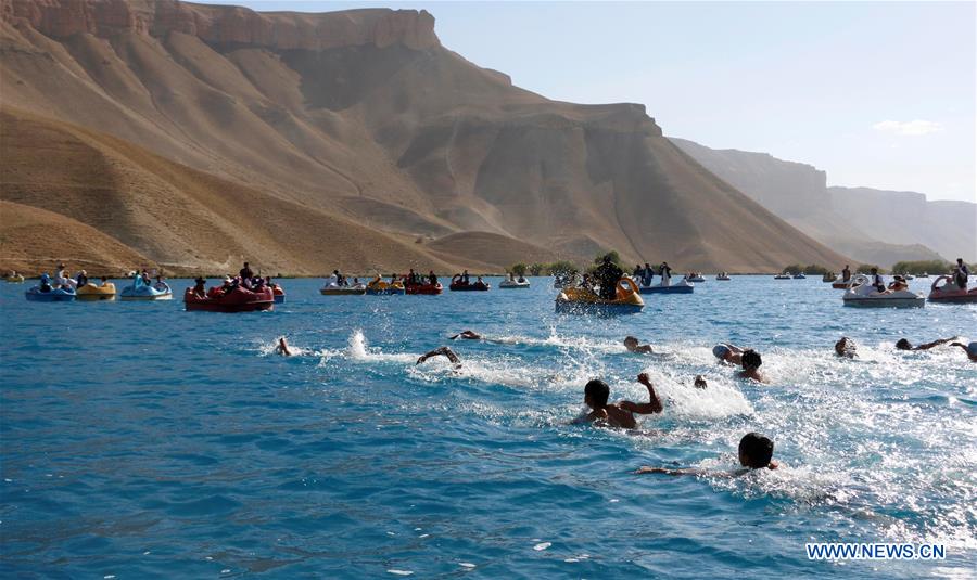 afghan men participate in swimming competition in